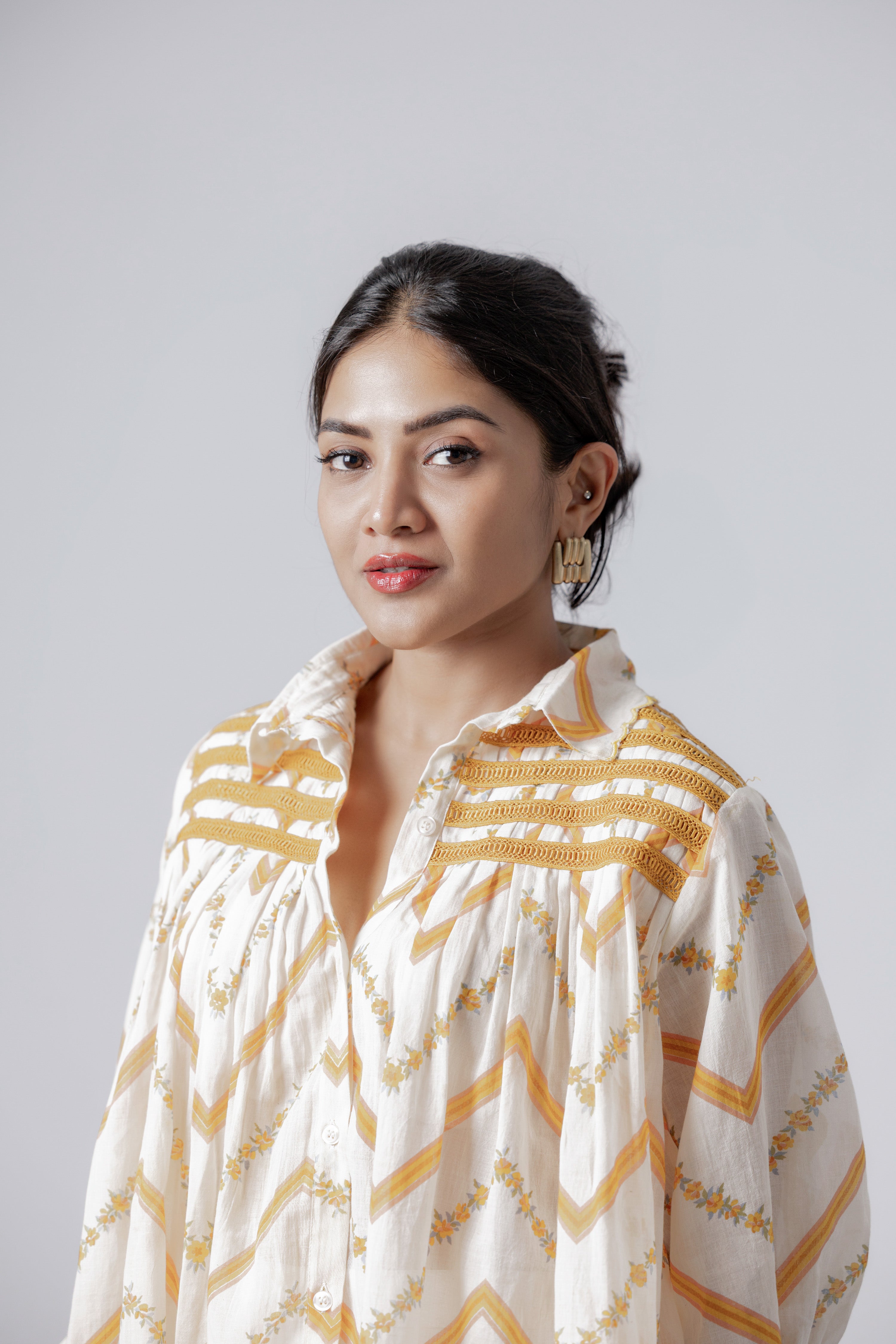 Handcrafted mustard chevron yoke detail on peplum cotton top